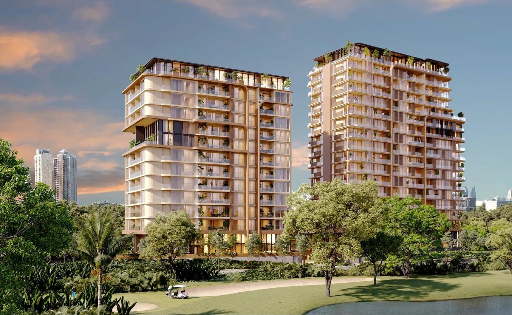 Two Bosco di Santa María towers at sunset beside the Santa Maria golf course lake