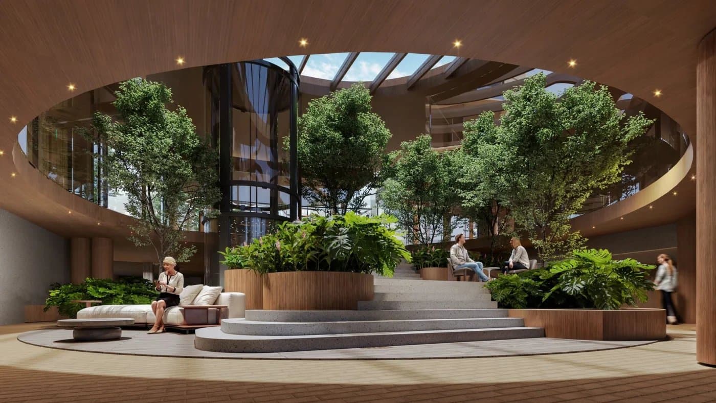 Atrium lounge with indoor trees and skylight at Bosco di Santa María