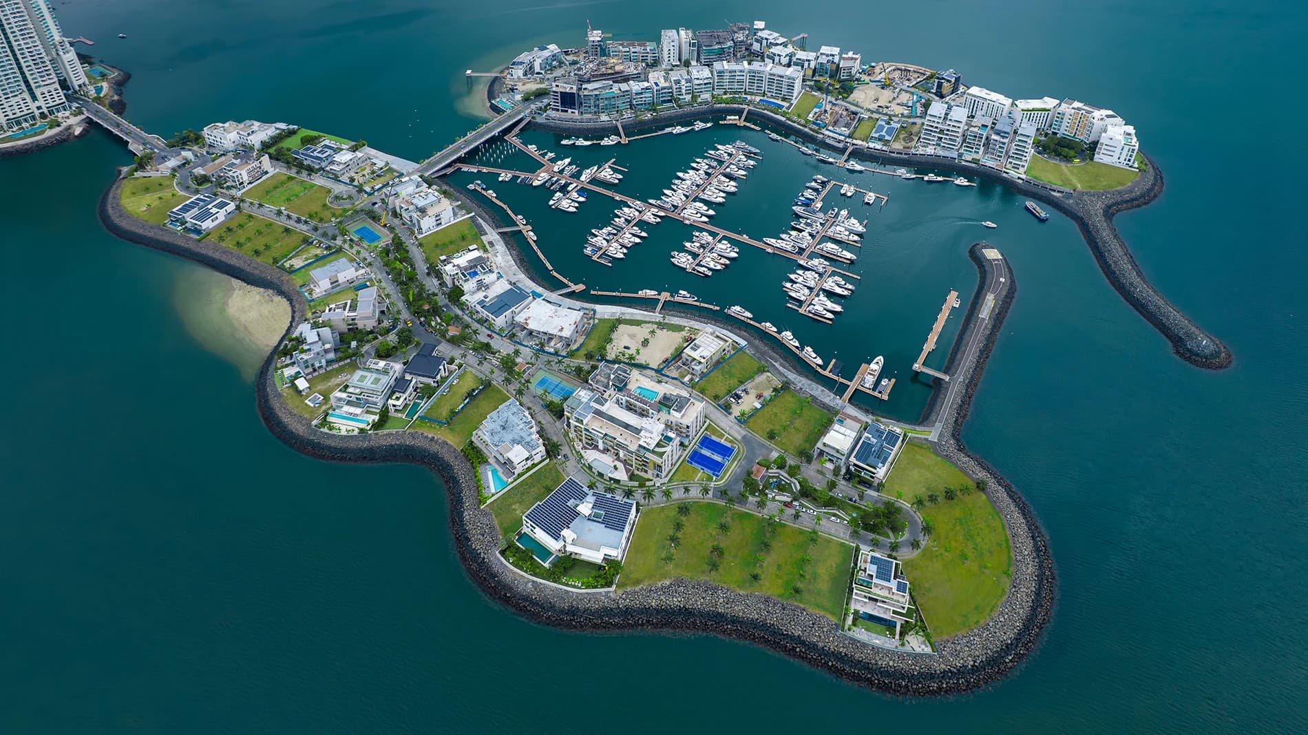 Aerial view of an Ocean Reef Islands island with its marina and breakwater in Panama Bay