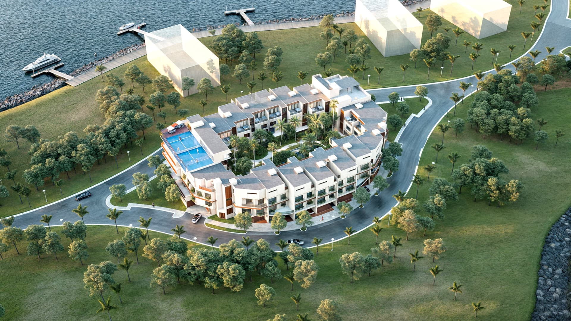 Aerial view of the curved Ocean Reef Park townhouse complex around its central park and pool