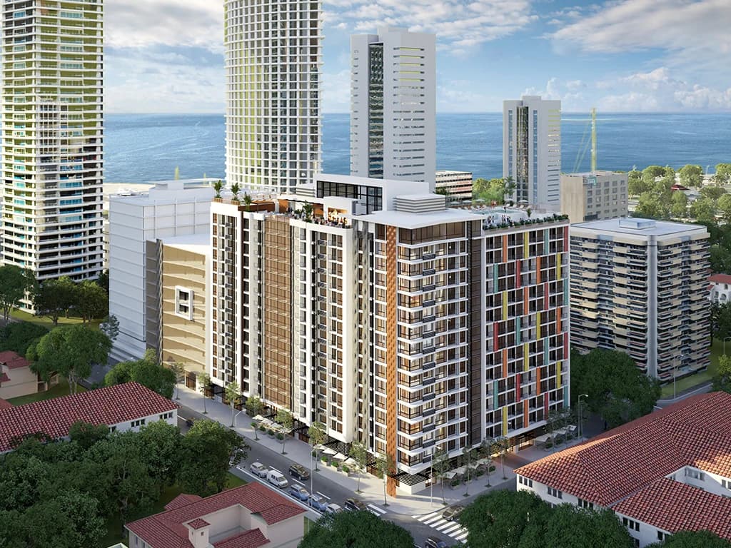 Aerial view of Armonía with its colorful facade near the Cinta Costera and Panama Bay