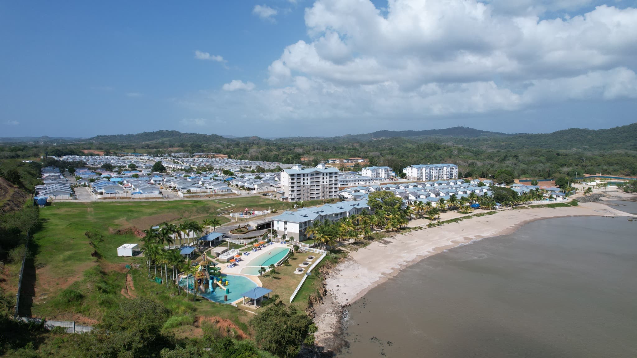 Aerial view of the Playa Dorada community and beach club along the coastline