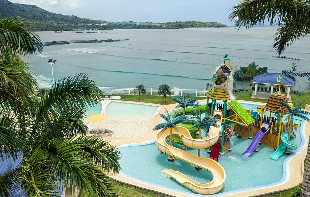 Playa Dorada beach club water park with slides by the sea