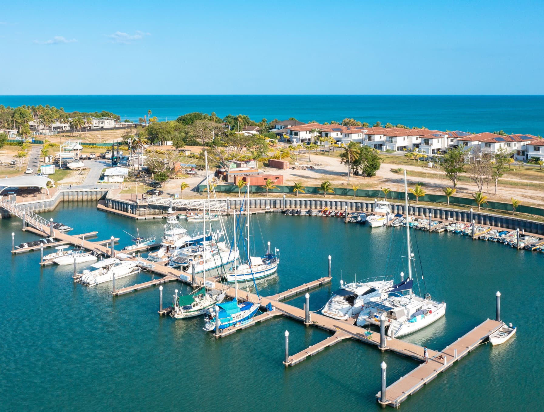 Aerial view of Buenaventura Marina with sailboats and Marina Village buildings