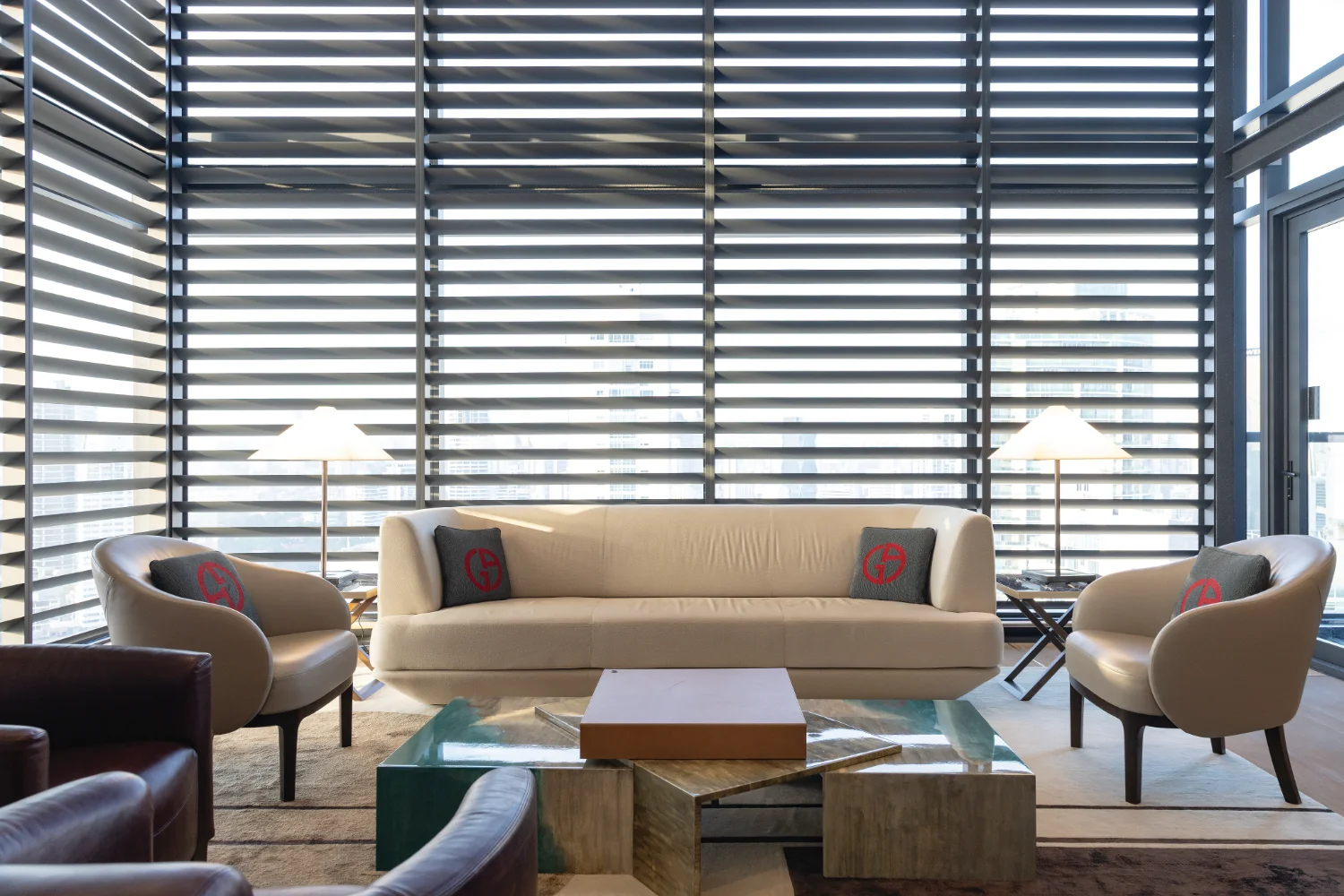 Nuovo by Armani/Casa lounge with sofas and floor-to-ceiling louvered windows