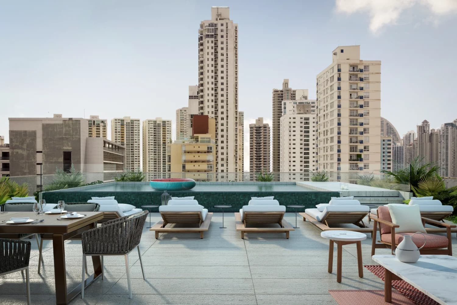 Loom Residences rooftop pool terrace with loungers and city skyline