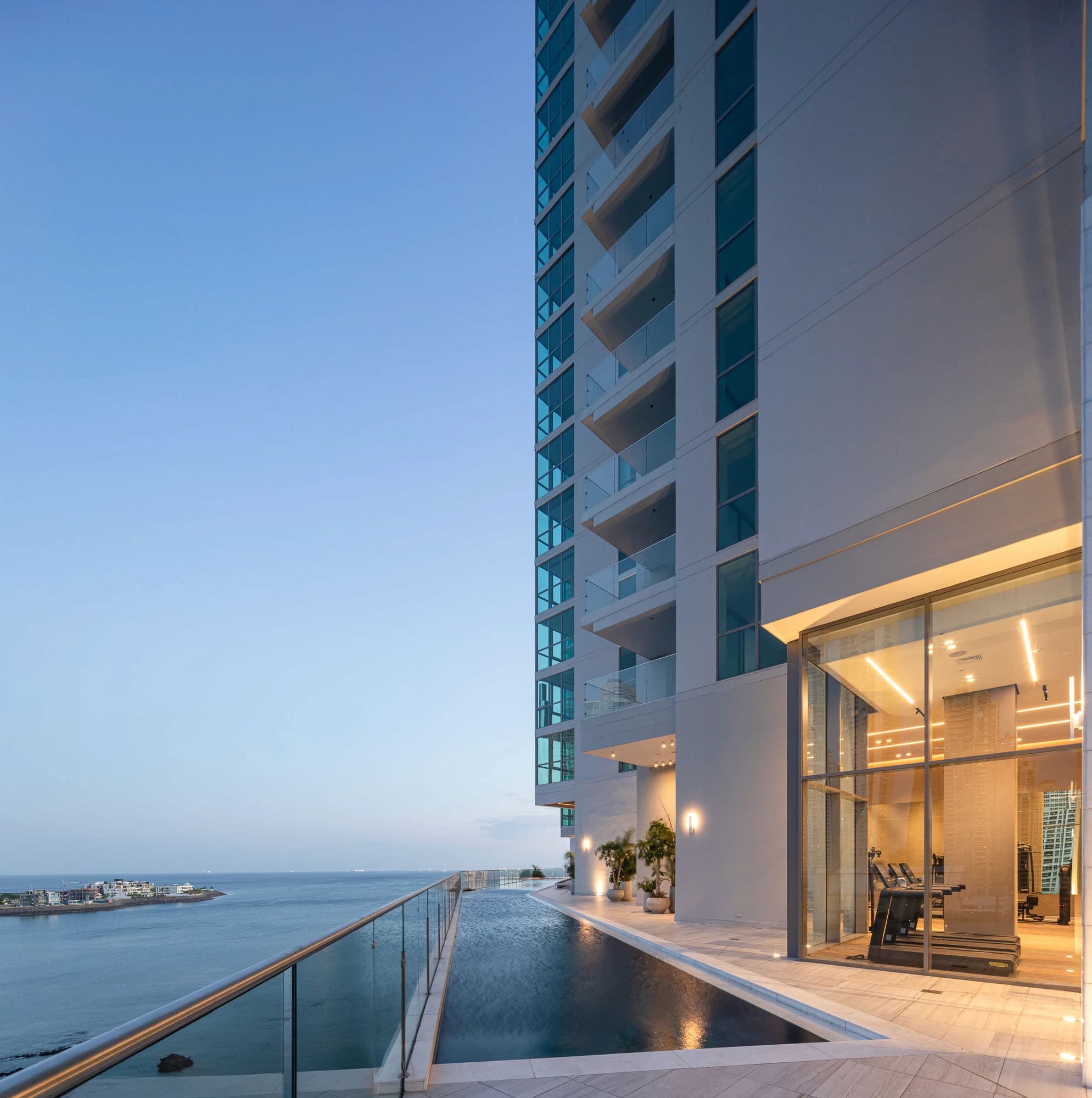 Sea Point tower rising above its oceanfront infinity pool on the Bay of Panama