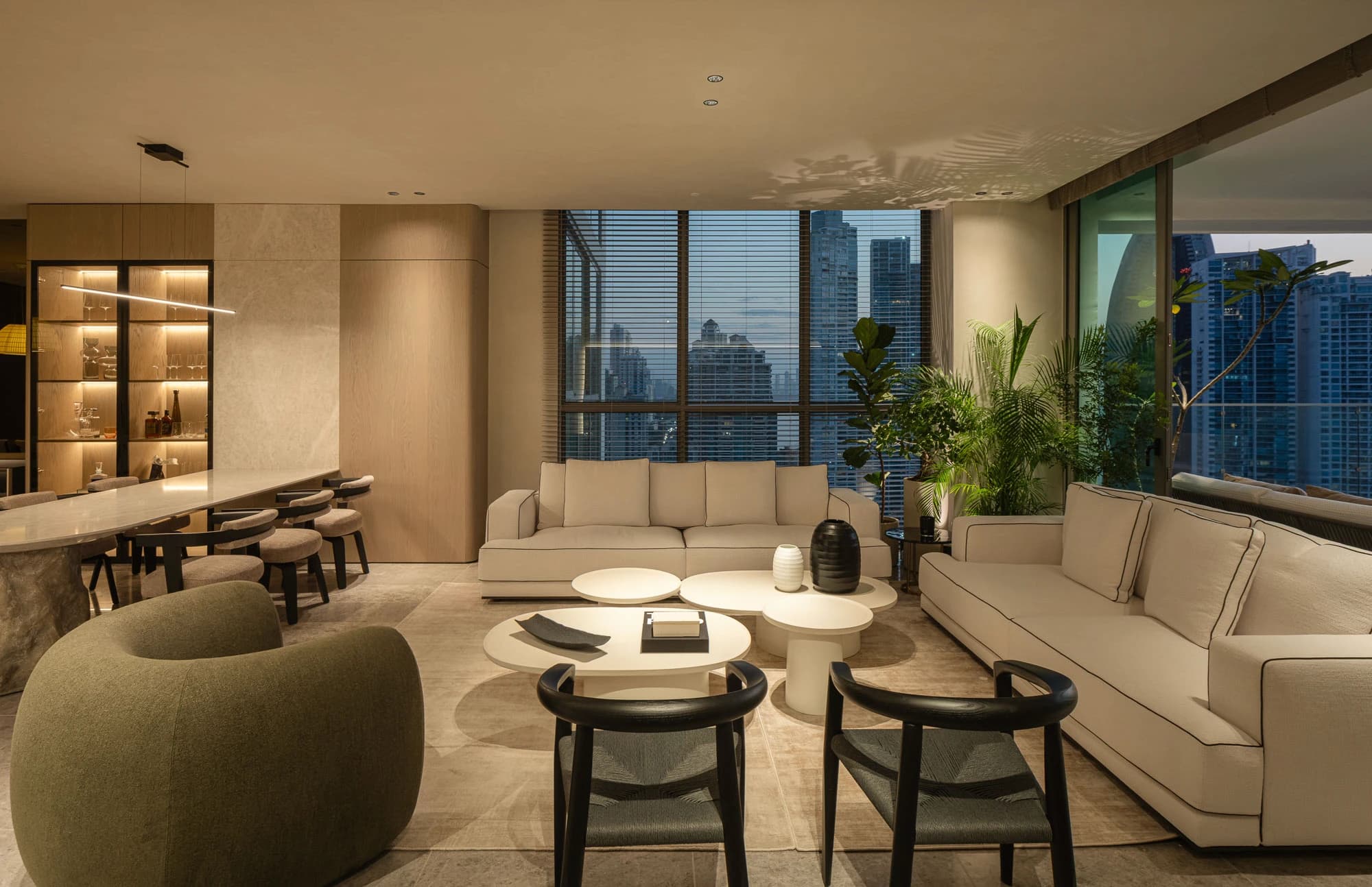 Open living and dining area with city views inside a Sea Point apartment