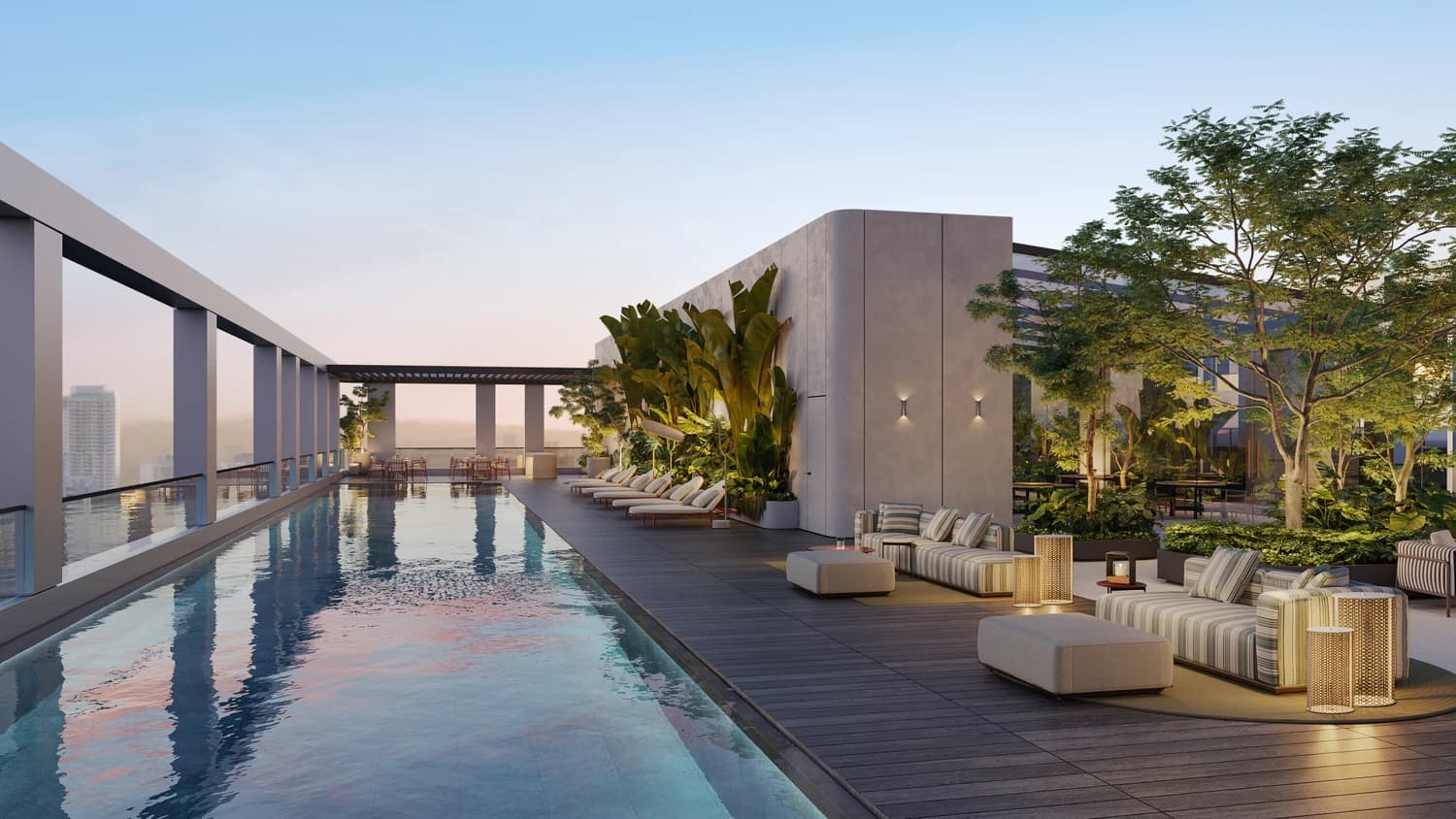 Rooftop pool deck with lounge seating and city views at MOVA