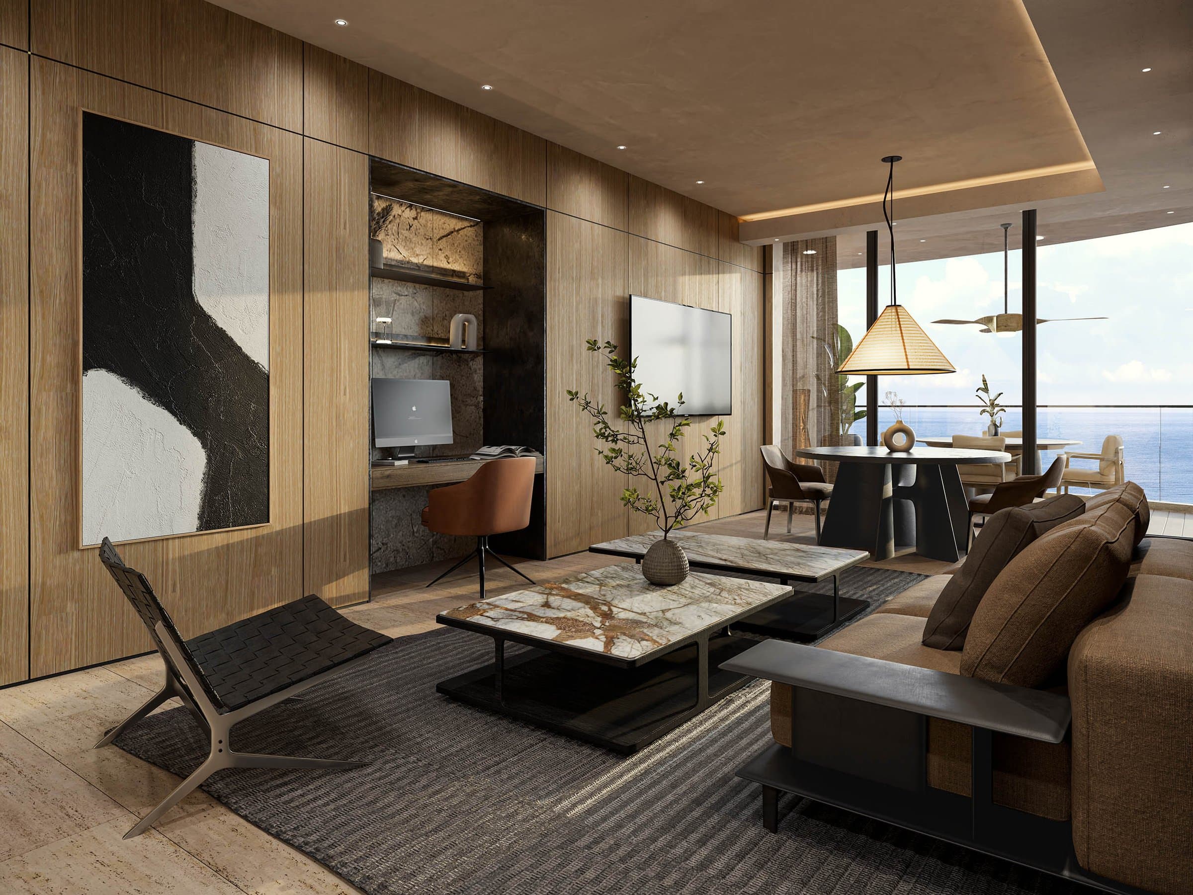 Family room with lounge chair and ocean view in a Tagua apartment