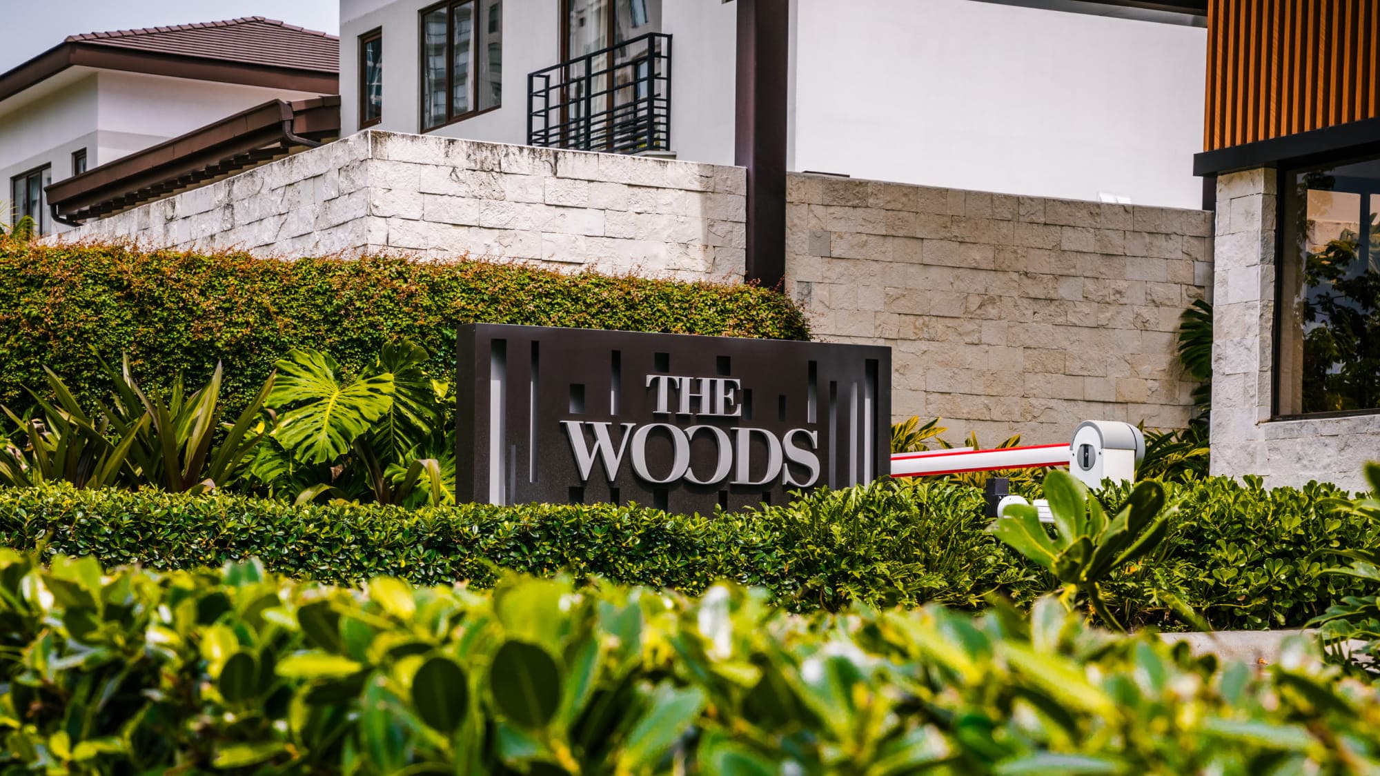Entrance sign of The Woods residential community in Santa Maria