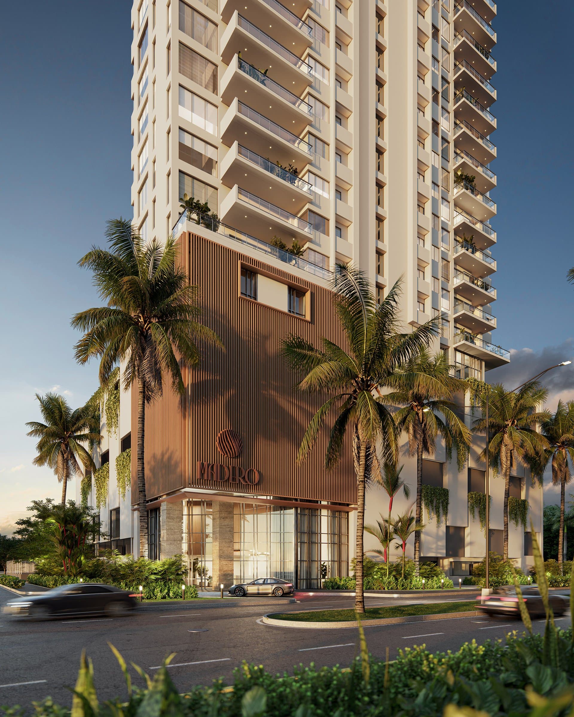 Madero tower base and landscaped entrance at dusk in Costa del Este