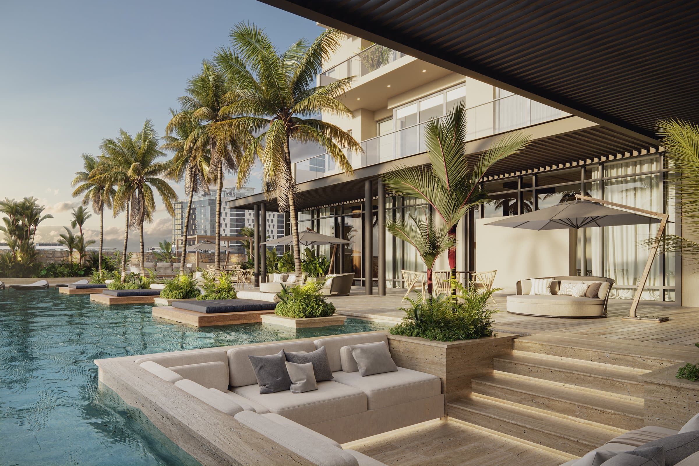 Poolside lounge with sunken seating and palms at Madero