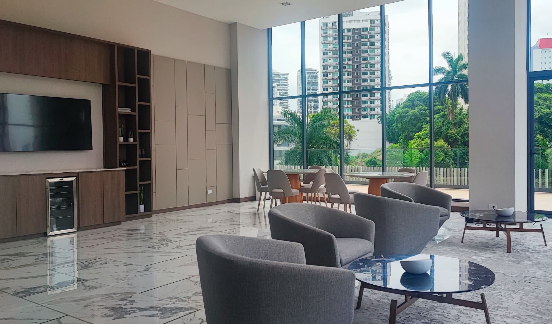 Owner's lounge with city-view windows at Prestige Bella Vista