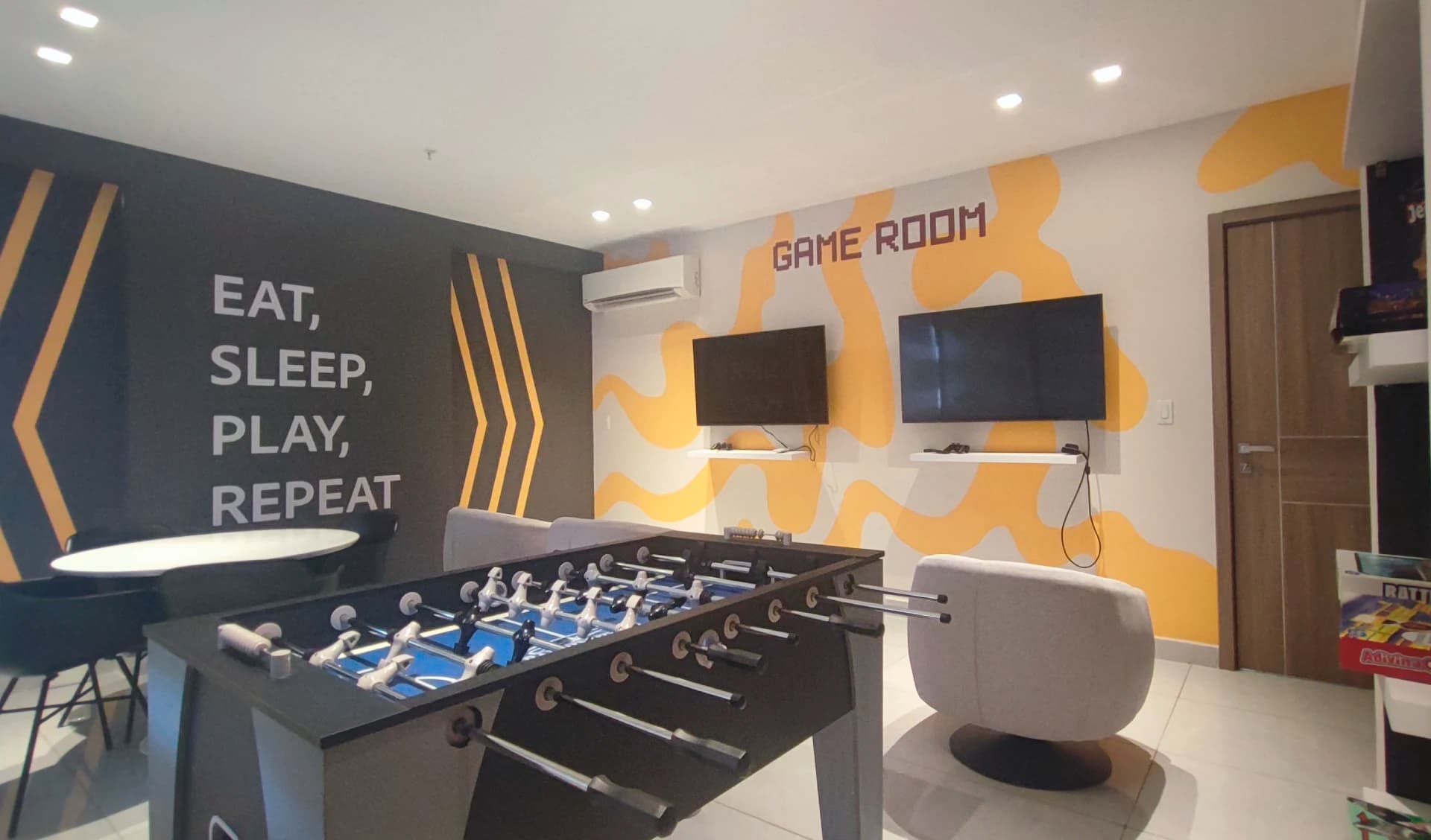 Game room with foosball table at Prestige Bella Vista