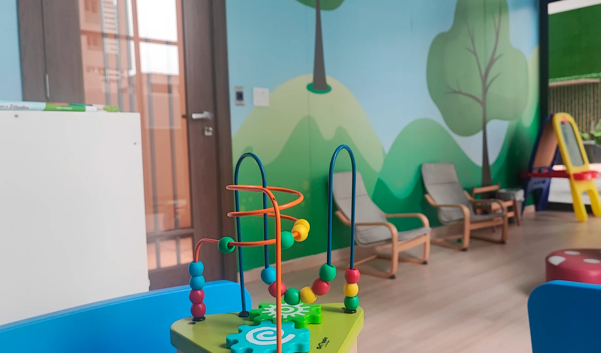 Kids' playroom with a painted mural at Prestige Bella Vista