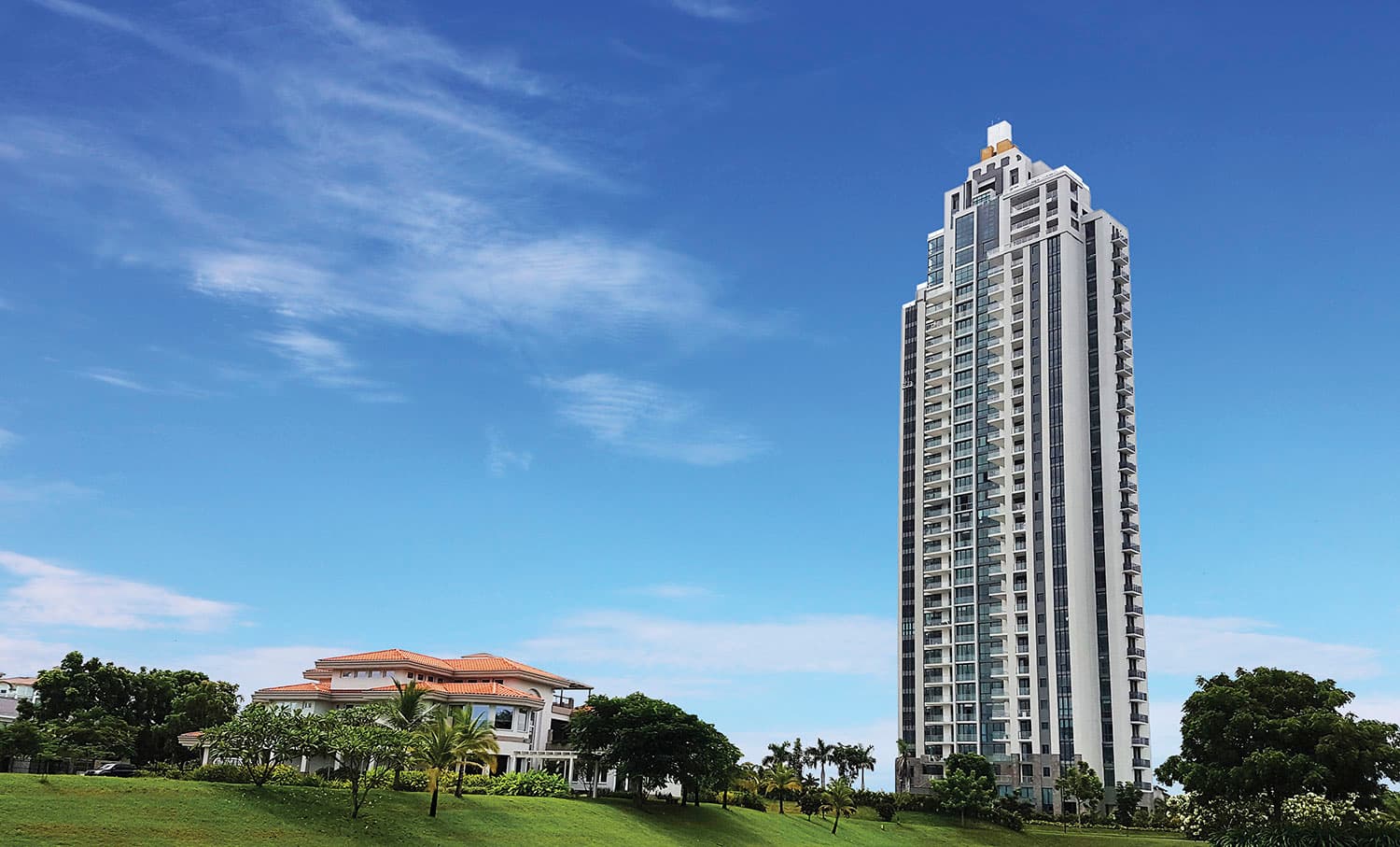 Valery Point tower beside the Santa Maria clubhouse under a blue sky