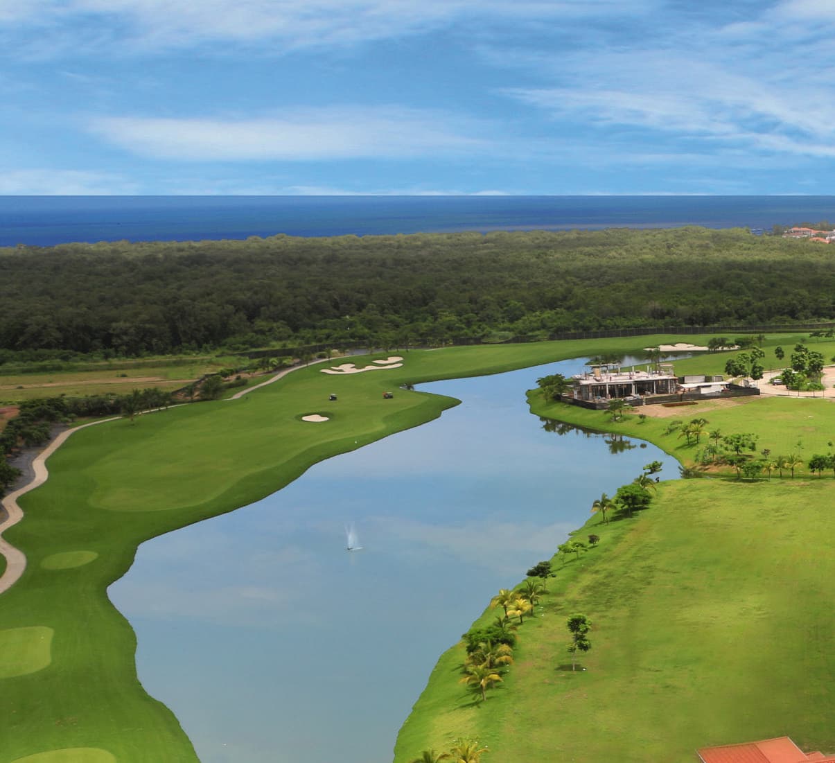 Aerial view of the Santa Maria golf course lakes toward the sea near Valery Point