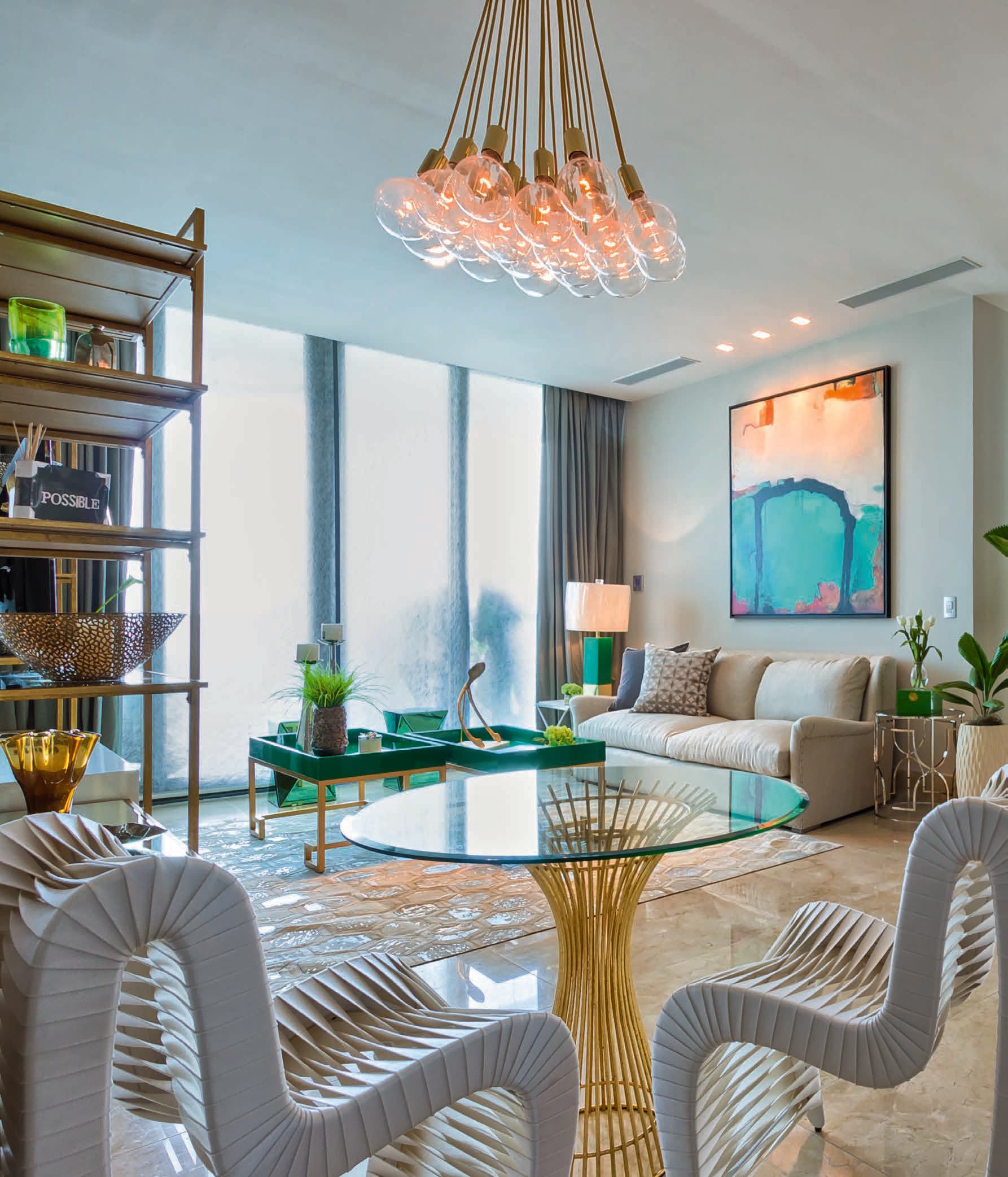Dining area in a Valery Point penthouse with a statement chandelier