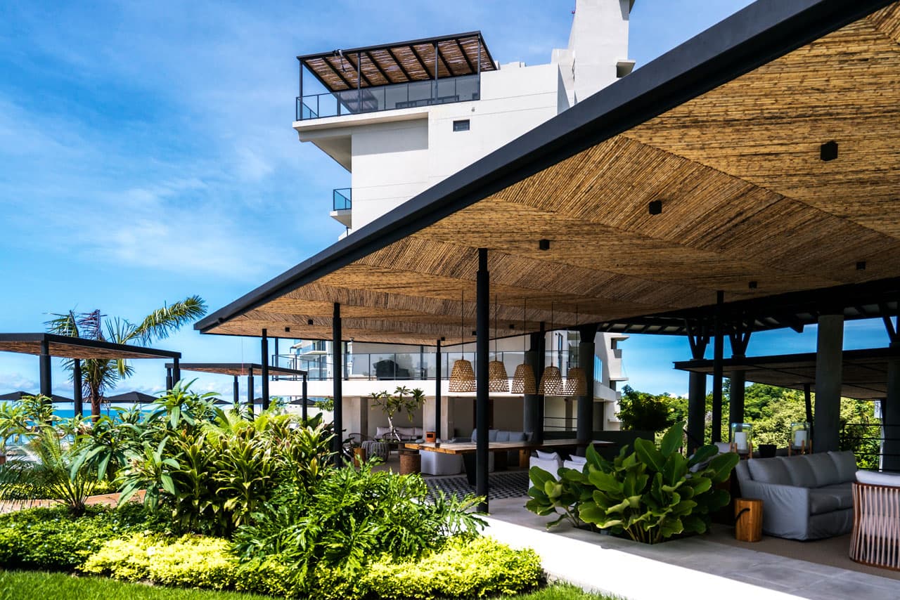 Open-air clubhouse pavilion surrounded by gardens at Solaria