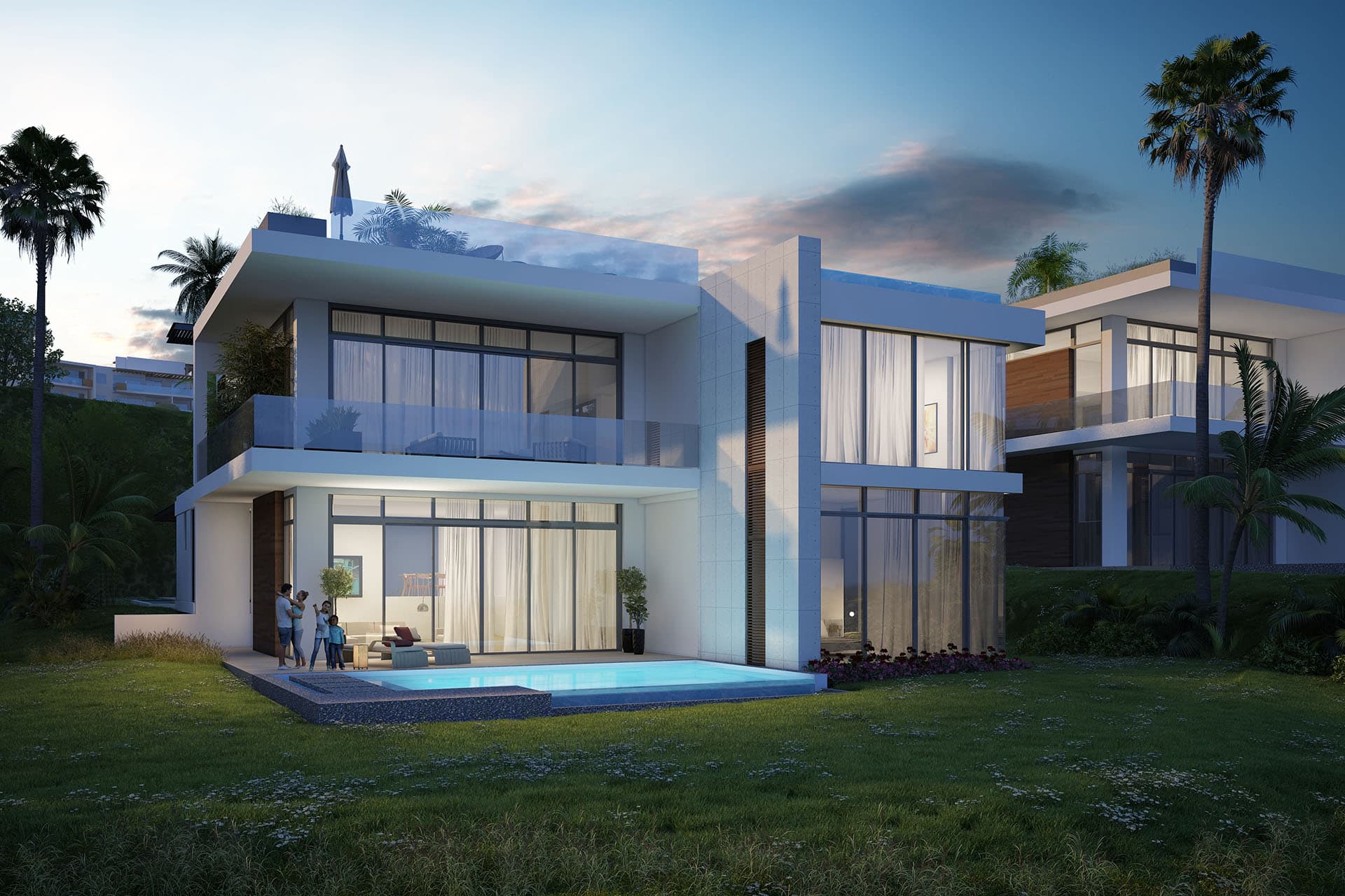 Caelo villa at dusk with its lit pool and garden, Punta Caelo
