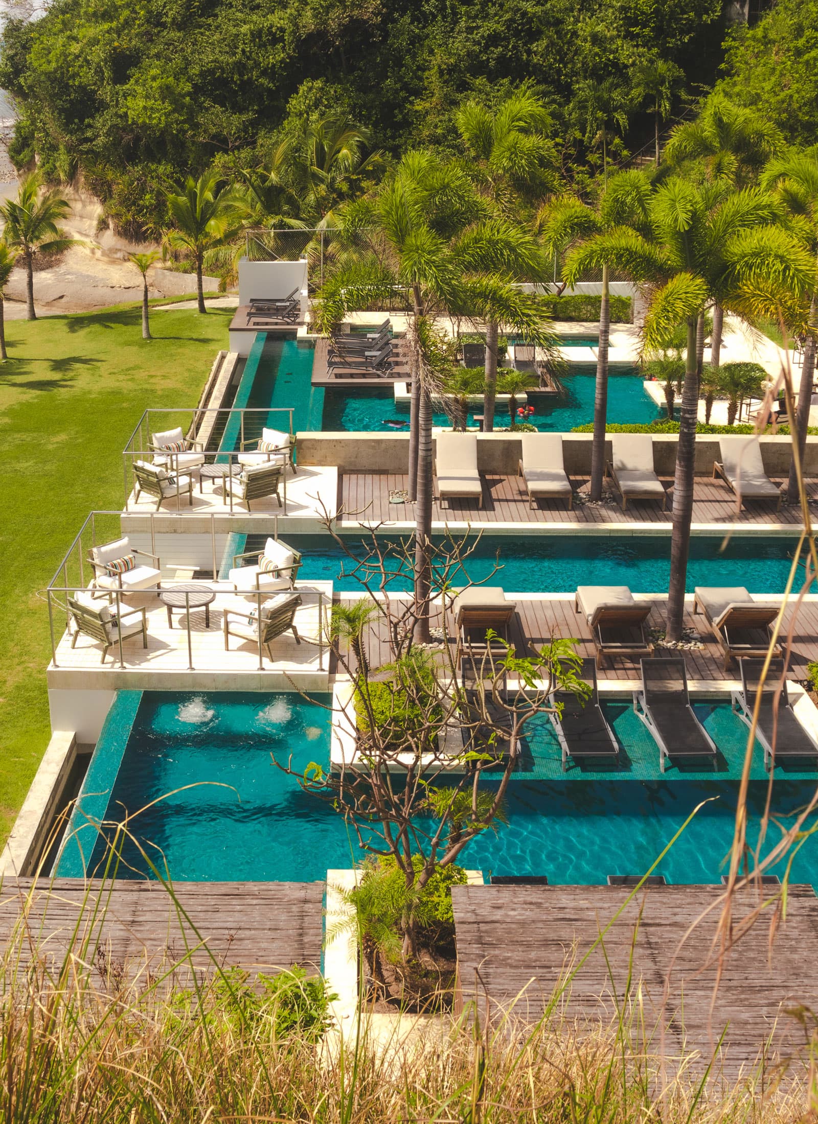 Aerial view of the terraced pools at Punta Caelo, home of the Caelo villas
