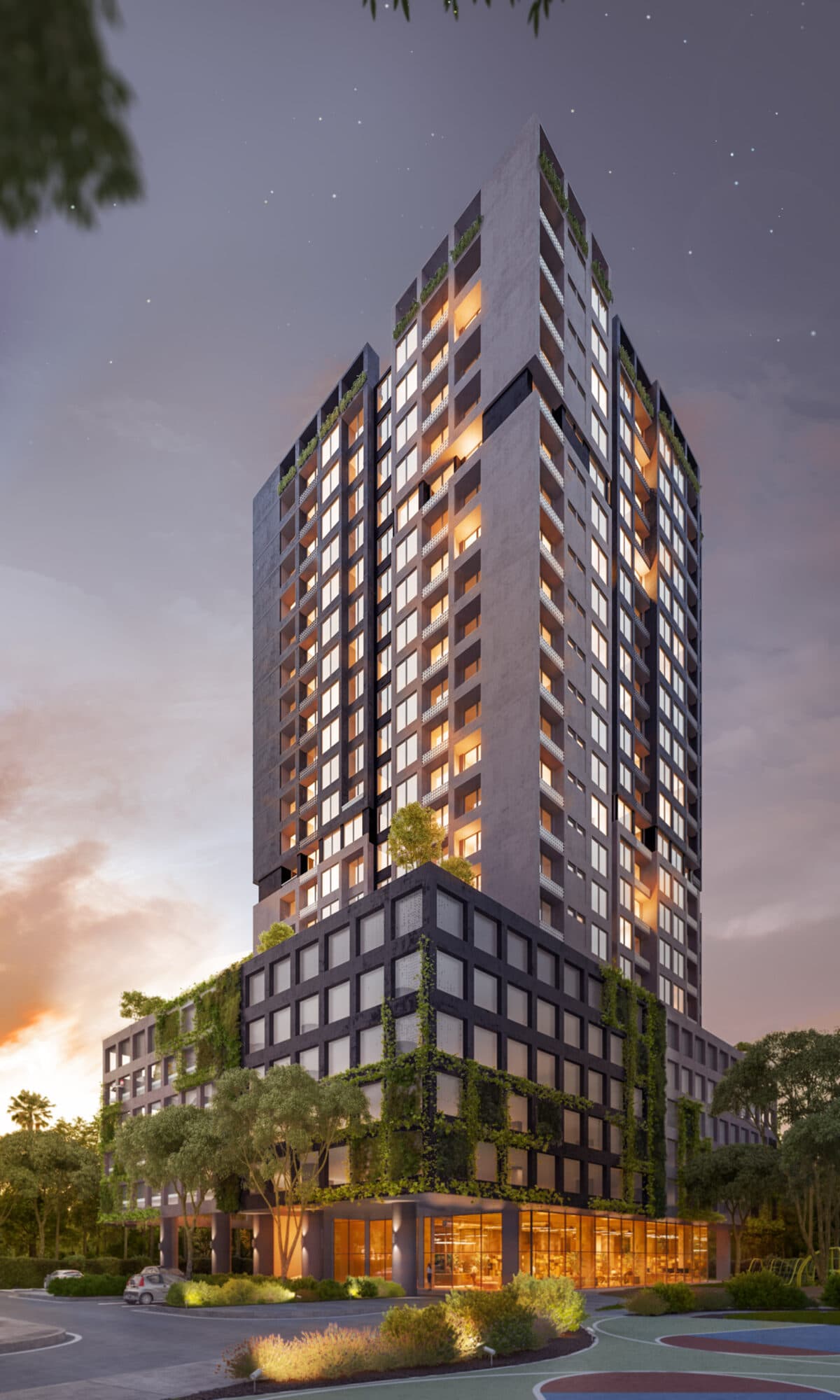 Rendering of the Quatrium residential tower lit at dusk above its planted podium on Vía Porras