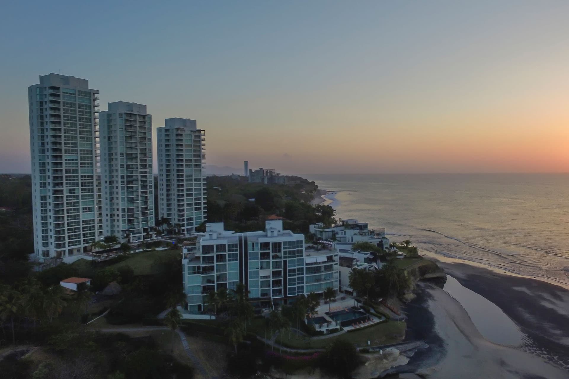 Aerial view of the Riomar towers on the Pacific coast at sunset