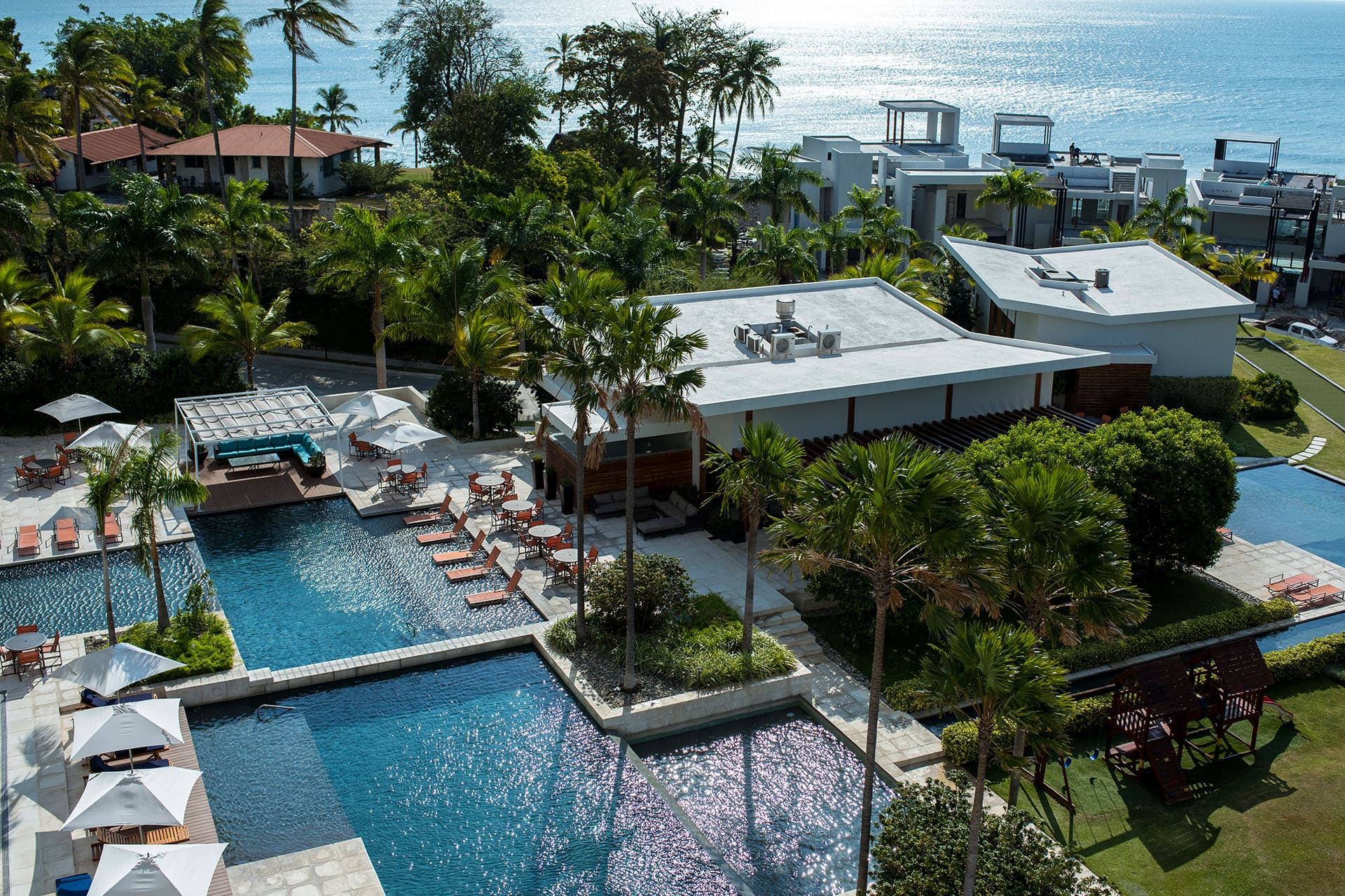 Aerial view of the Riomar pools and gardens with the ocean behind