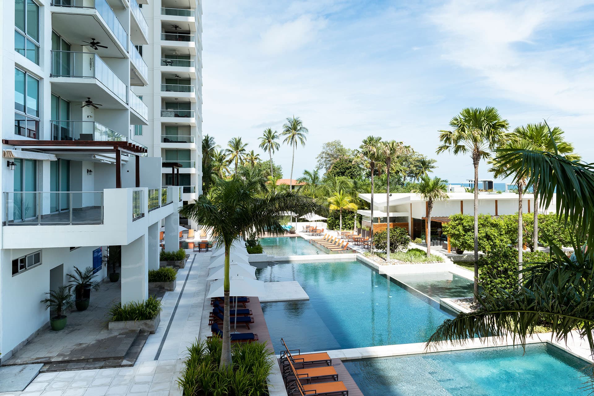 Riomar tower beside the long resort pool and tropical gardens