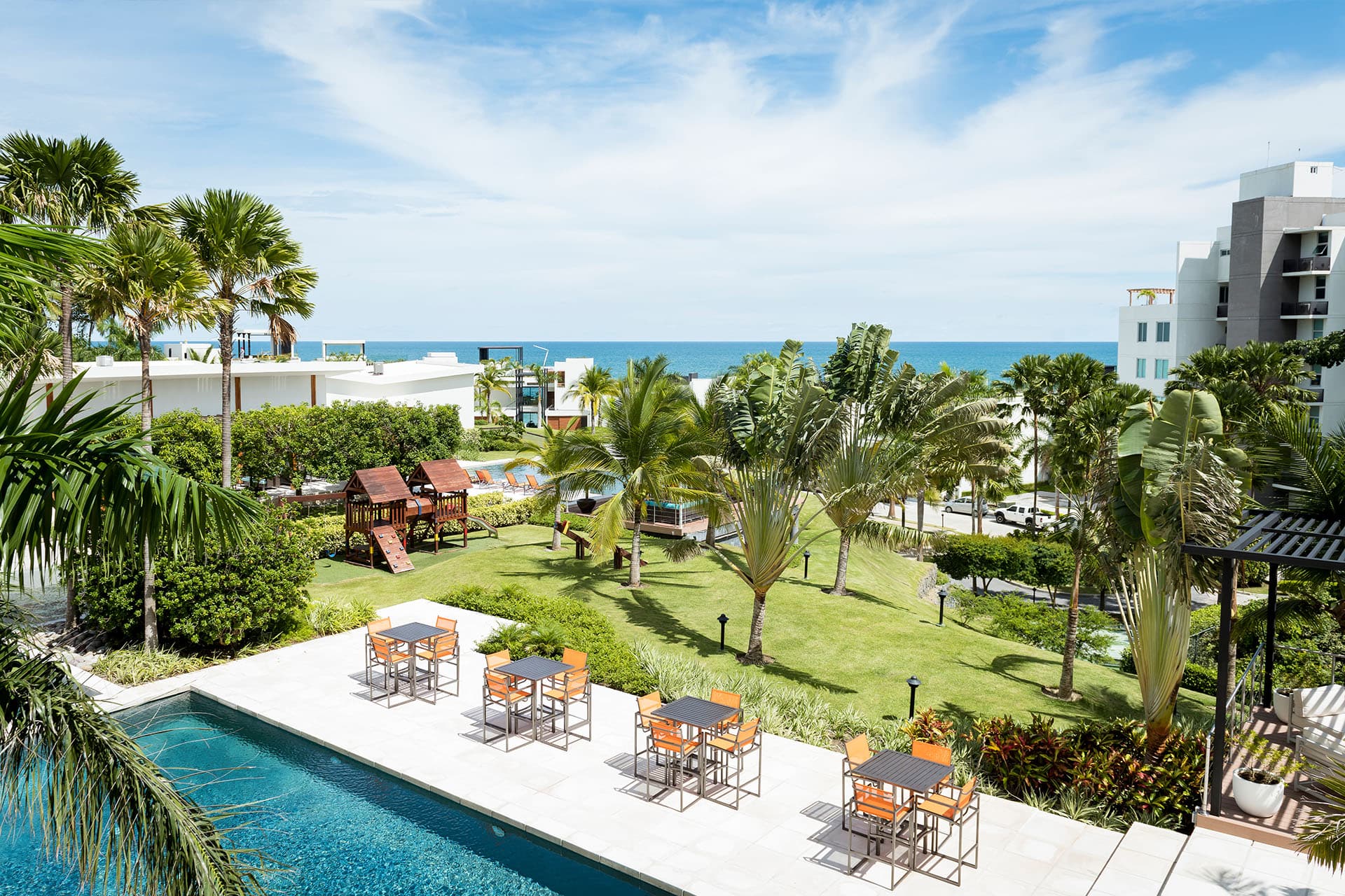 Garden and poolside terrace with ocean view at Riomar