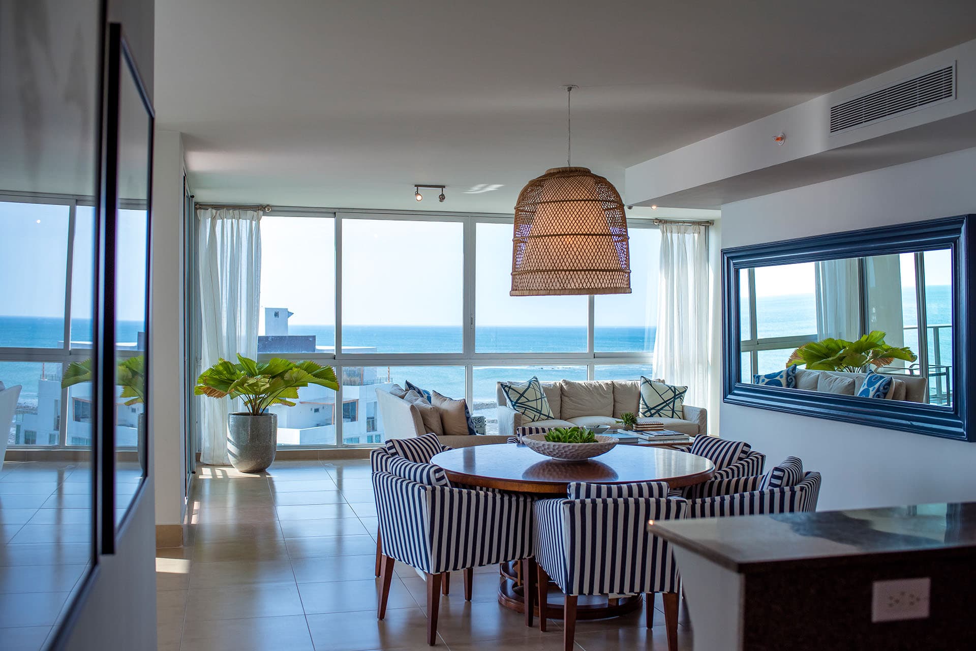 Ocean-view living and dining room in a Riomar apartment