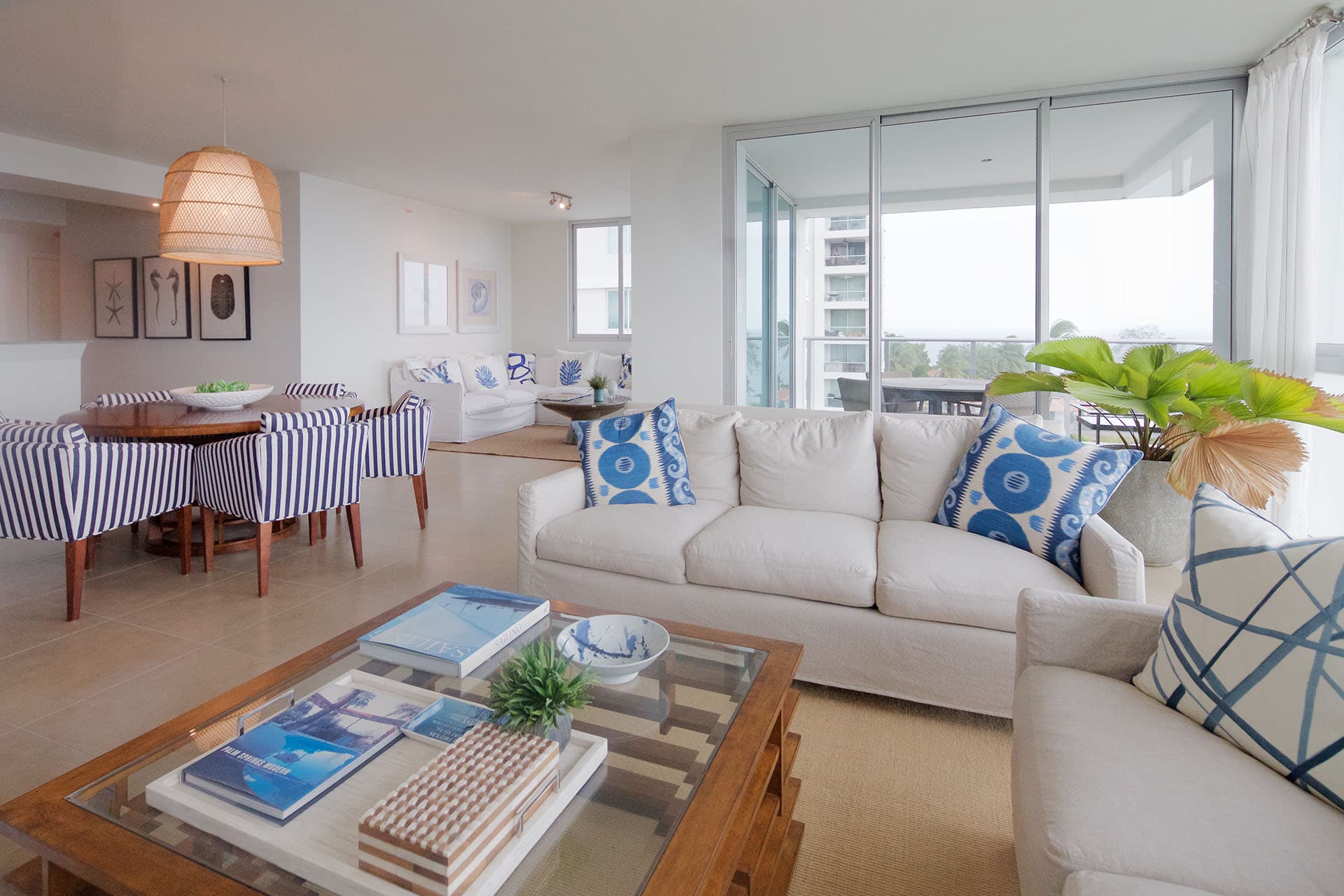 Bright living room with white sofas in a Riomar apartment