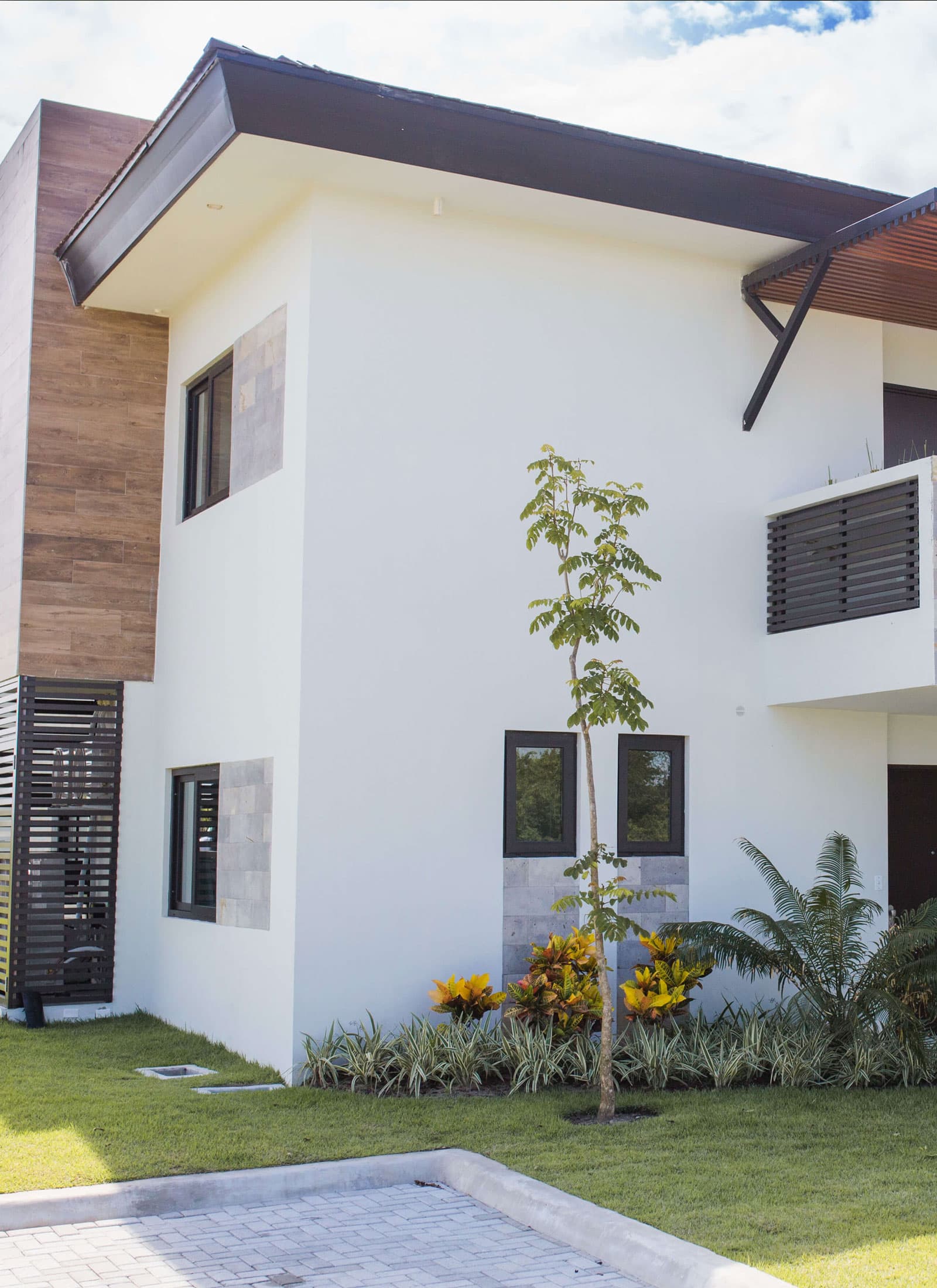 Two-story Luceros townhouse at Punta Caelo with stone and wood facade