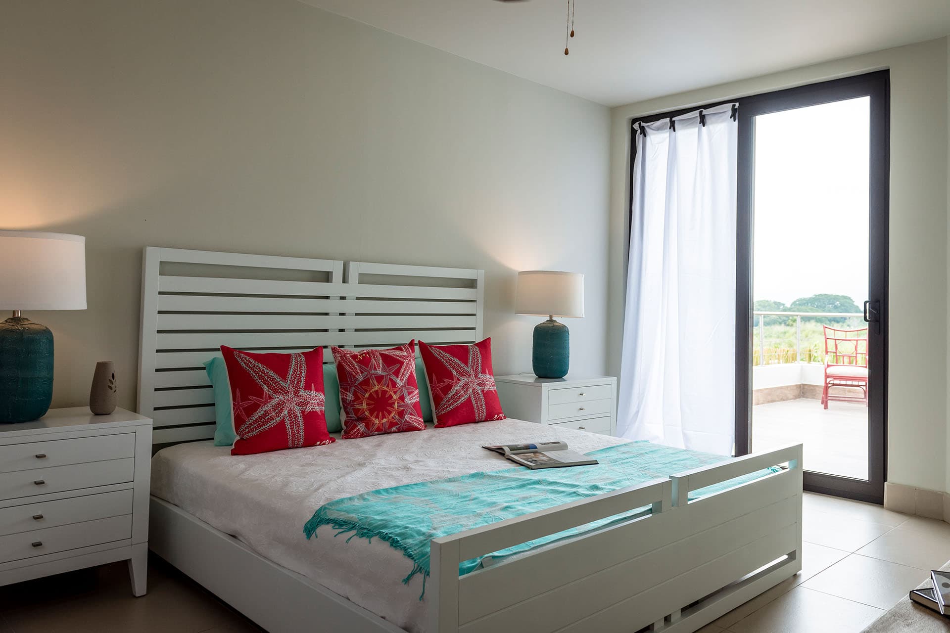 Bedroom with balcony door in a Luceros townhouse