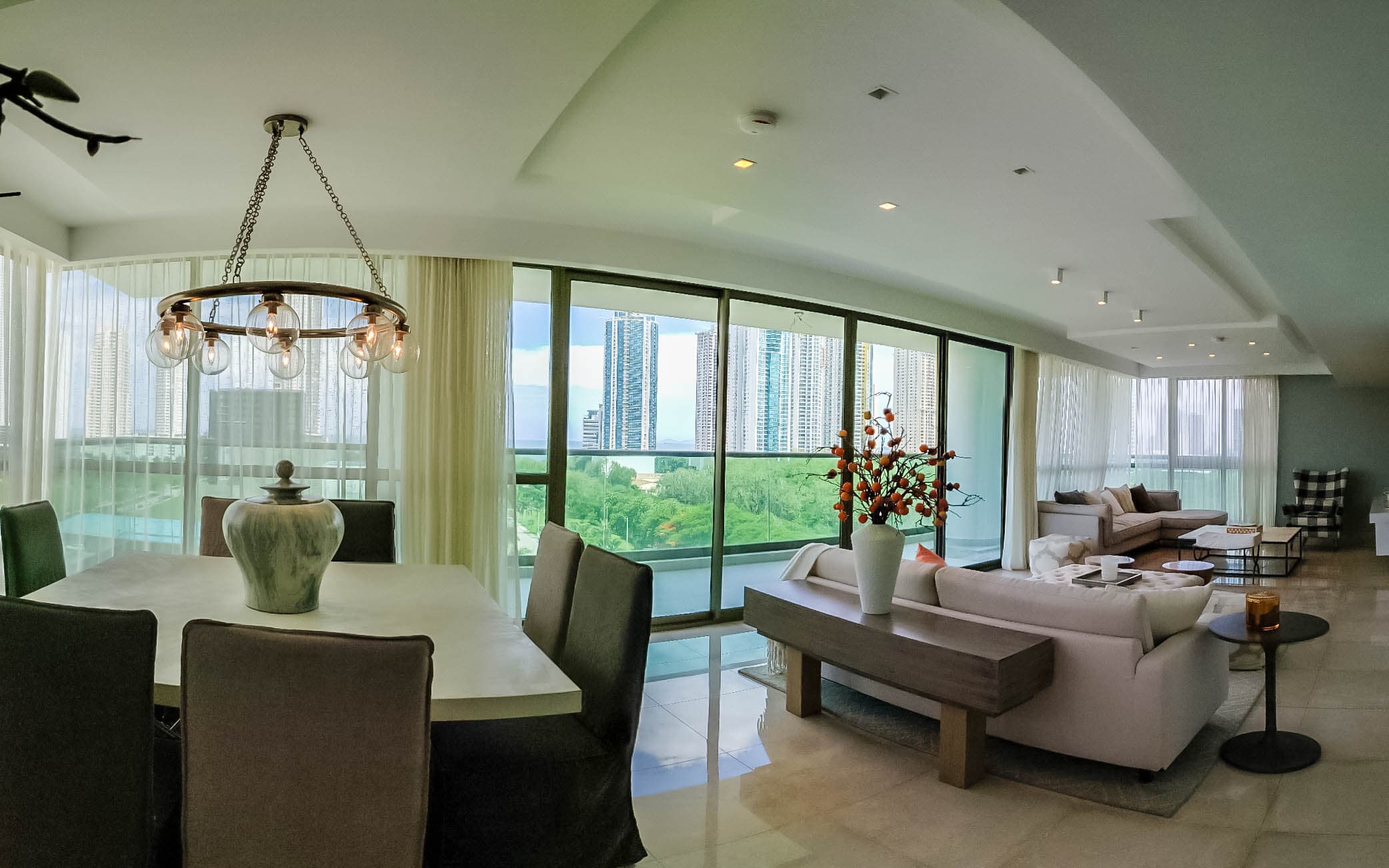 Open living and dining room with garden views in a Park Lane residence