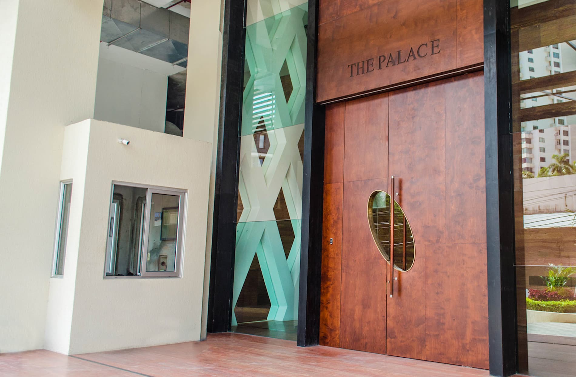 Wood-clad main entrance doors of The Palace tower