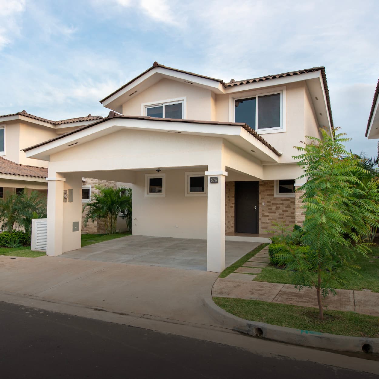 Two-story house with covered carport at Bosques del Pacifico