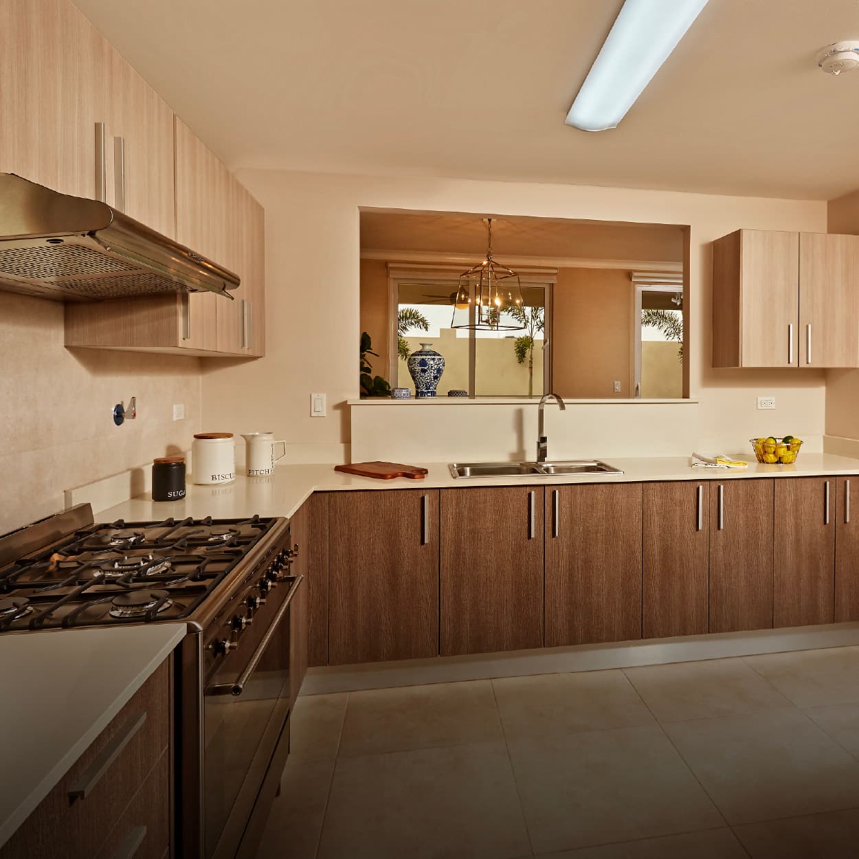 Kitchen with wood cabinets in a Bosques del Pacifico home