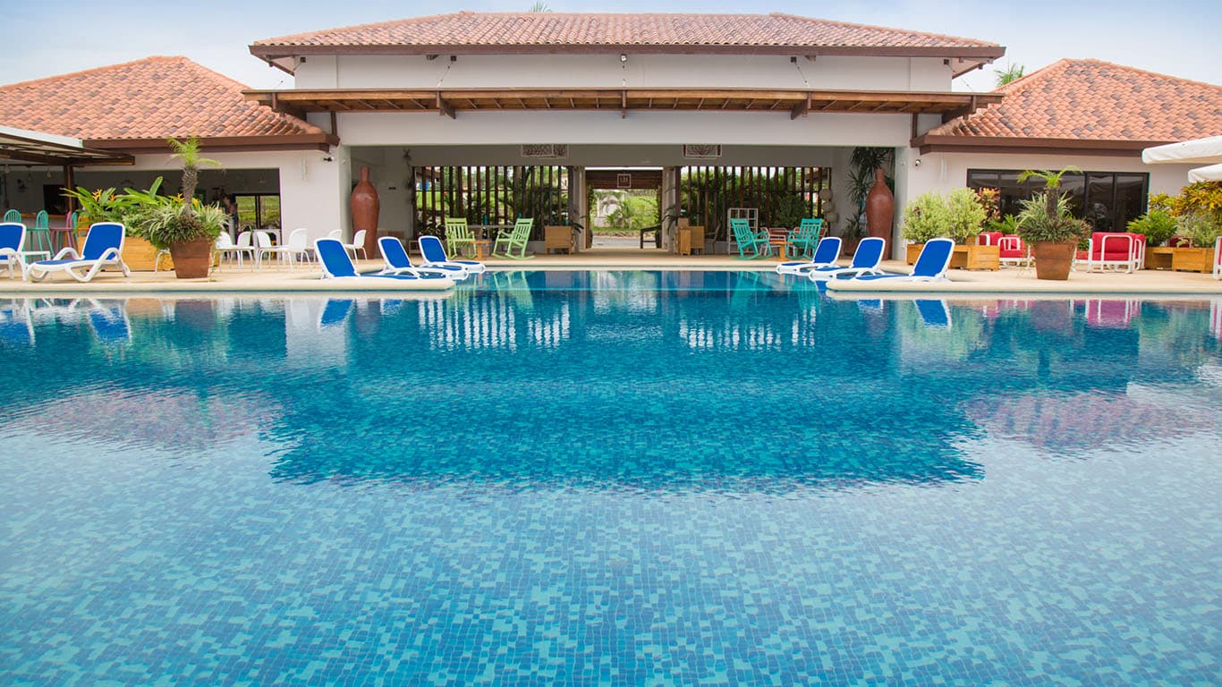 Andromeda Beach Club pool and clubhouse terrace