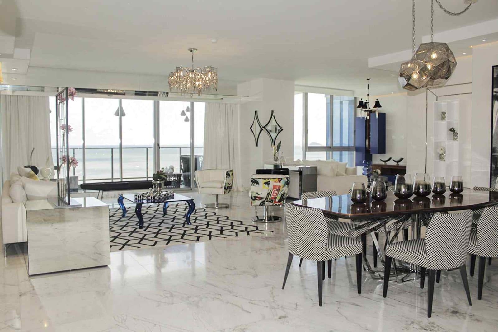 Living and dining room with ocean view in a Regalia model apartment