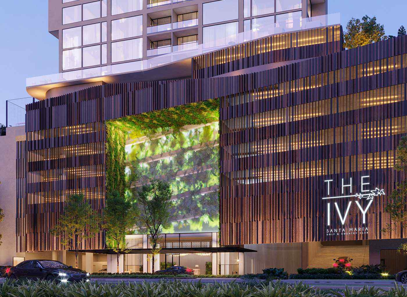 The Ivy tower podium with its vertical garden and wooden louver facade at dusk, Santa Maria