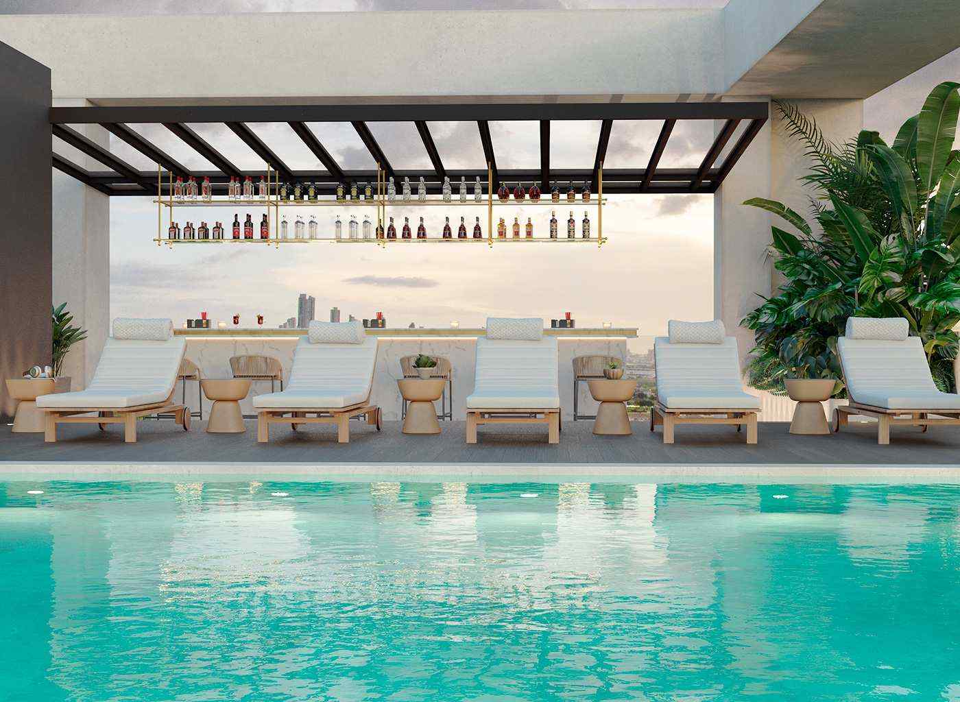 Pool and covered bar deck at The Ivy social area