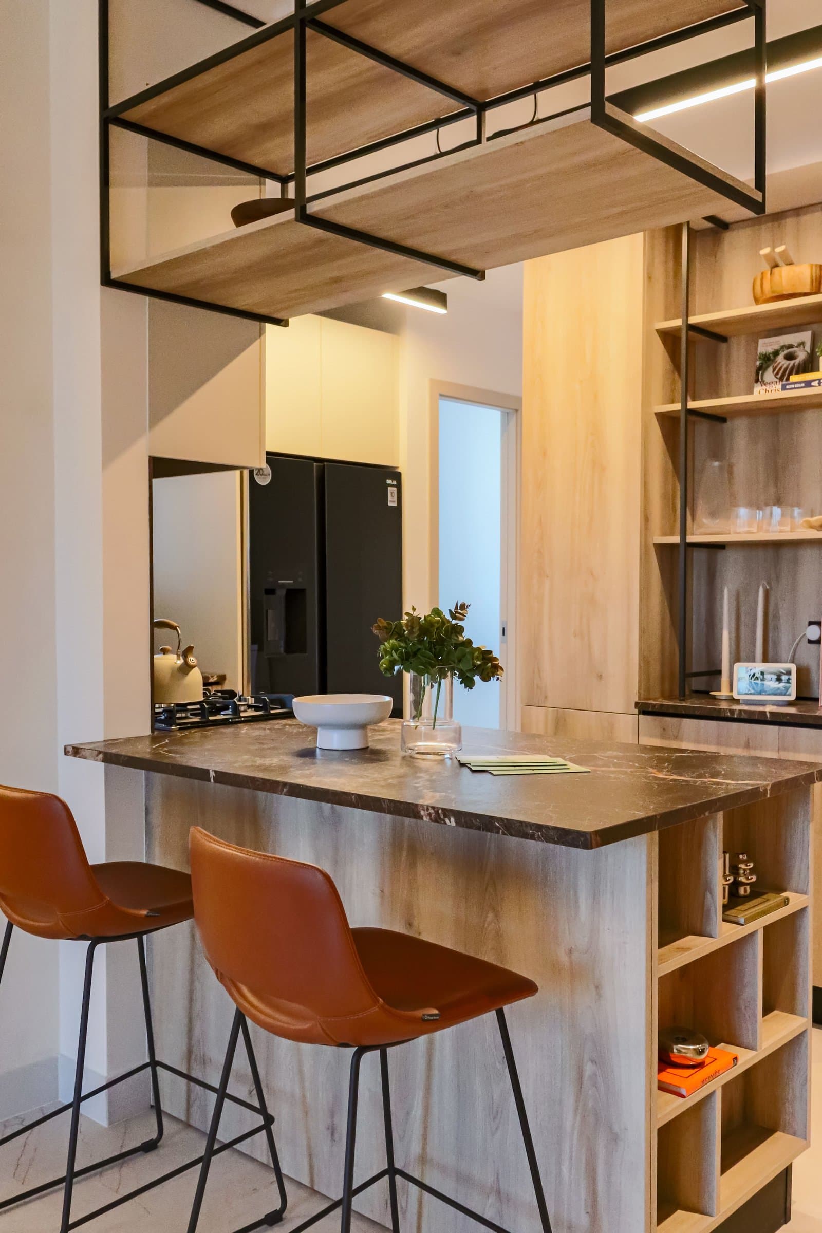 Kitchen with island and bar stools in the NEXT model apartment, Coco del Mar