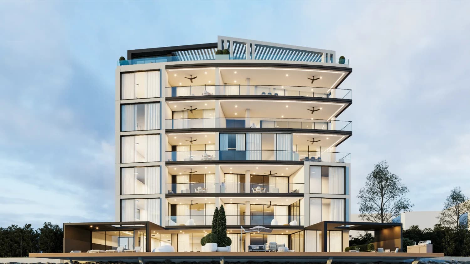 Casa 55 front facade with terraces and ground-level pool at dusk
