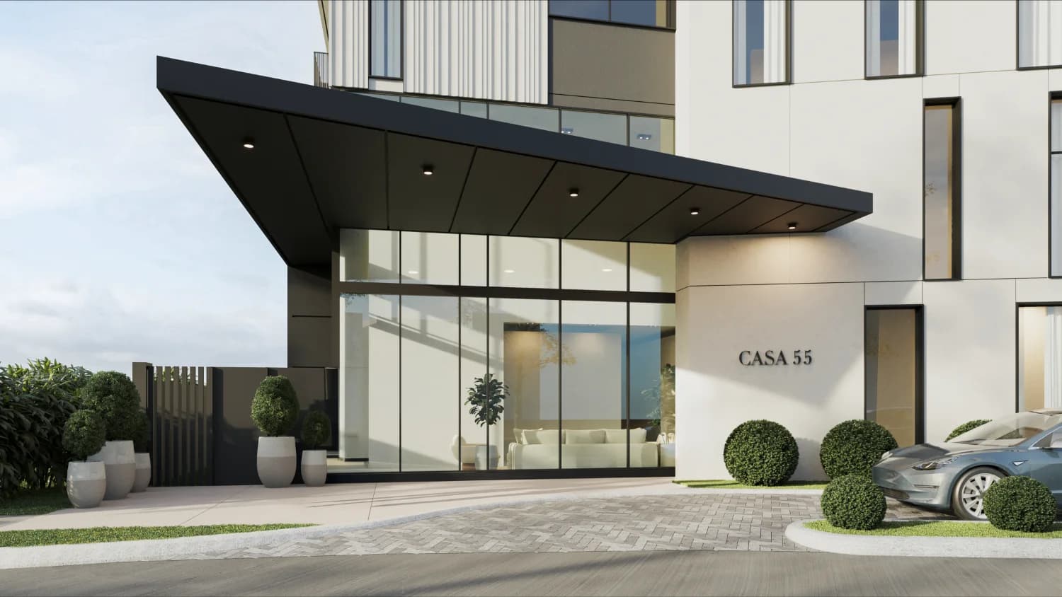 Casa 55 entrance and drop-off with building signage