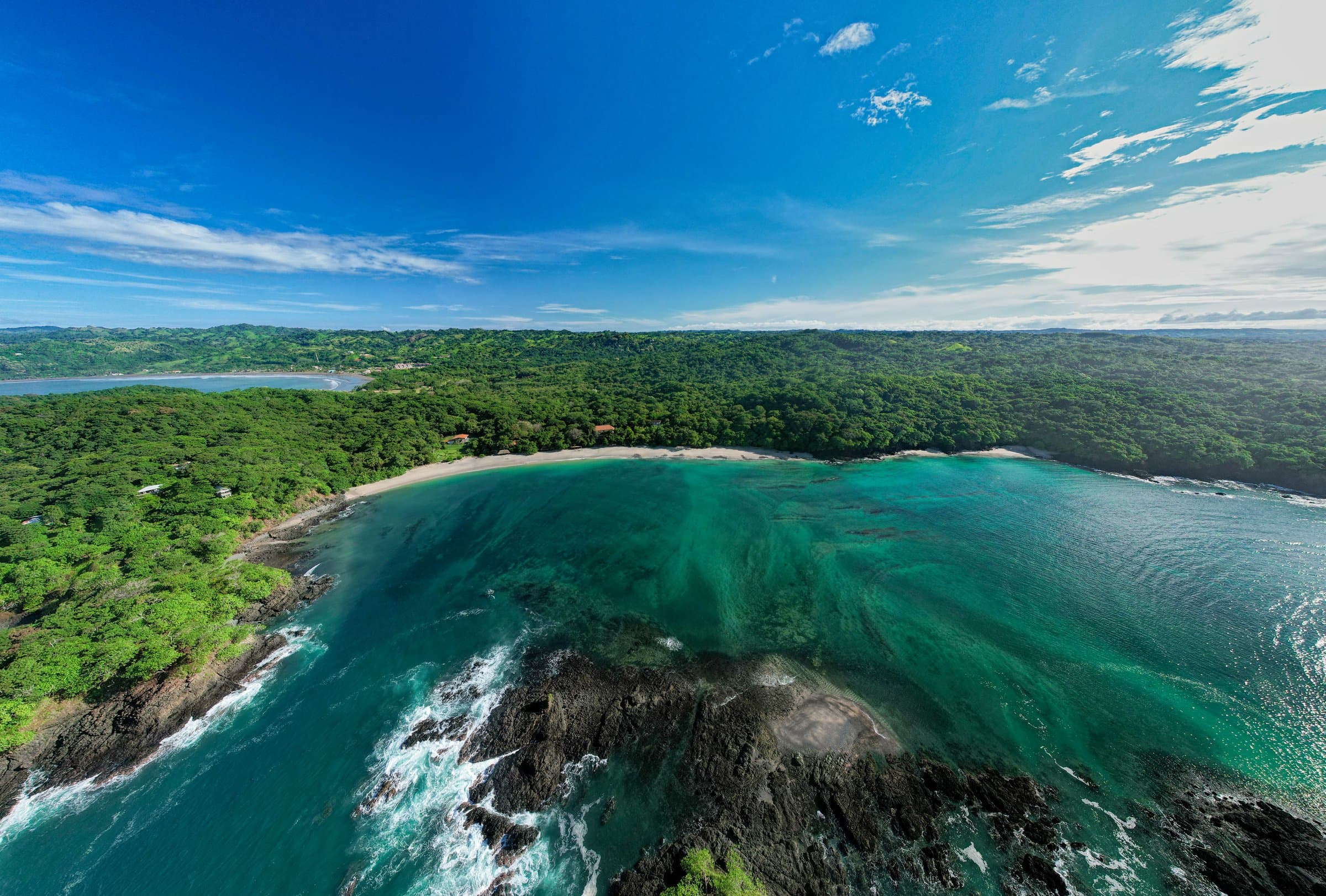Aerial view of Achotines Bay and the jungle-covered coast at Vervana, Playa Venao