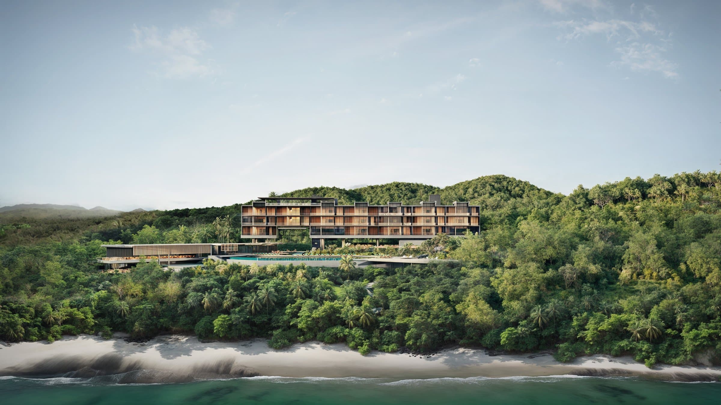 Vervana residences seen from the sea, set in the coastal forest