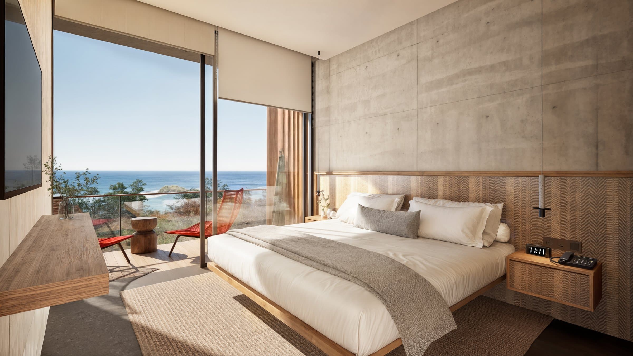 Bedroom with sliding glass wall and ocean view at Vervana
