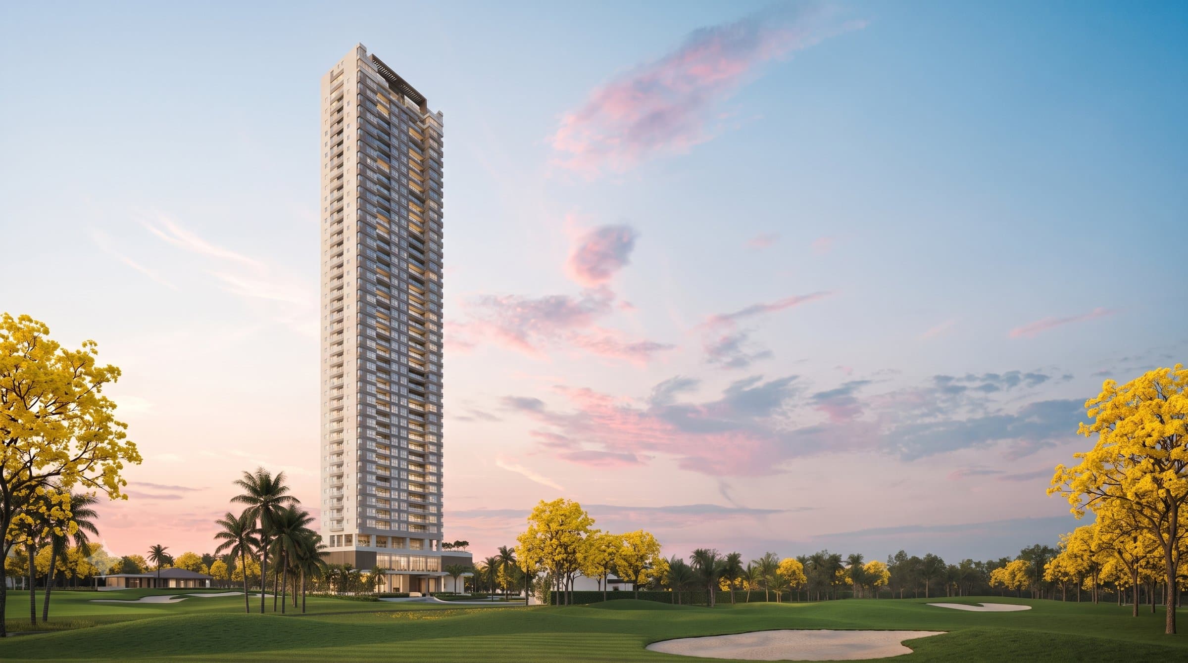 Guayacan residential tower rising beside the Santa Maria golf course at sunset